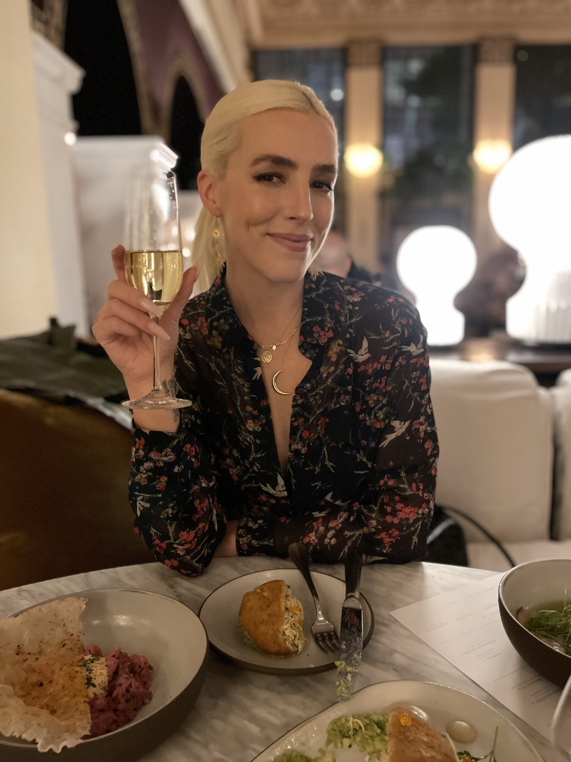 Caroline holding champagne
